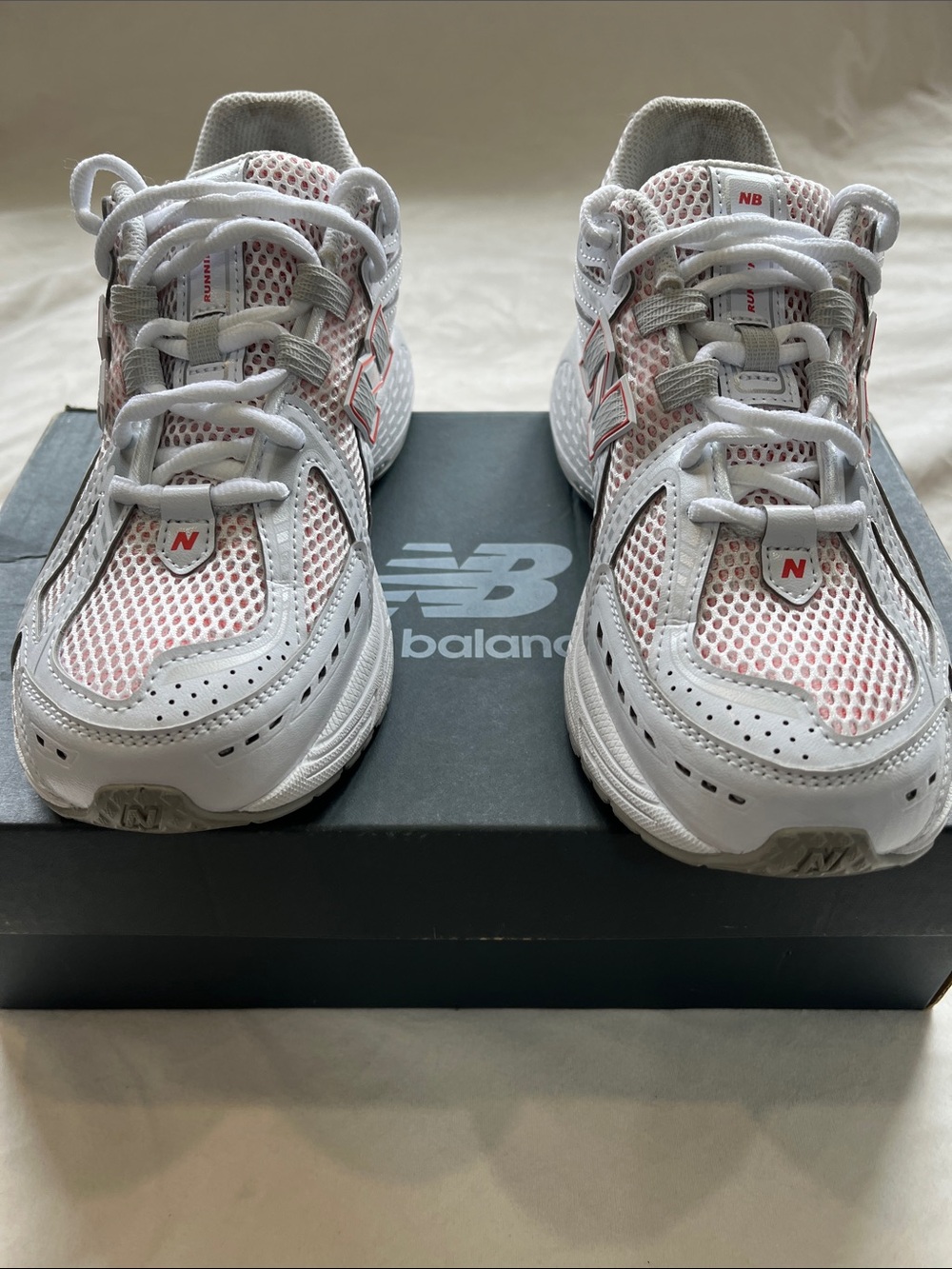 New Balance White and Light Pink Mesh Sneakers